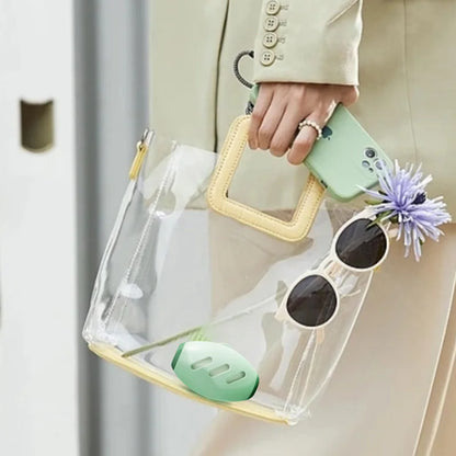 Compact reusable lint roller carried in a clear handbag, showing its travel-friendly size